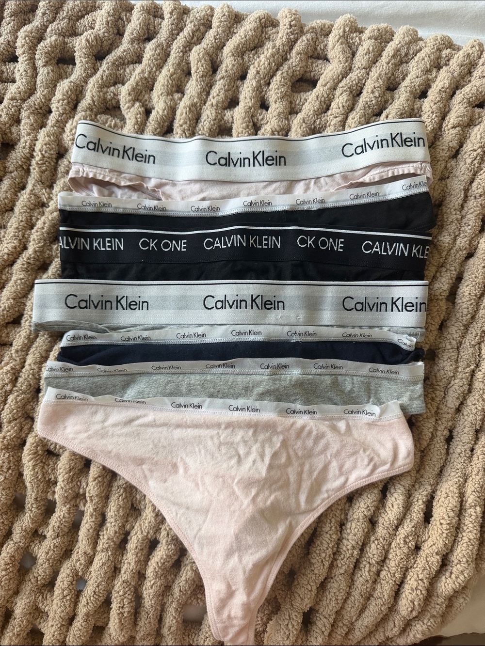 Calvin Klein Logo Waistband Thong Set — Light Pink, Black, White, Gray. 7 total.